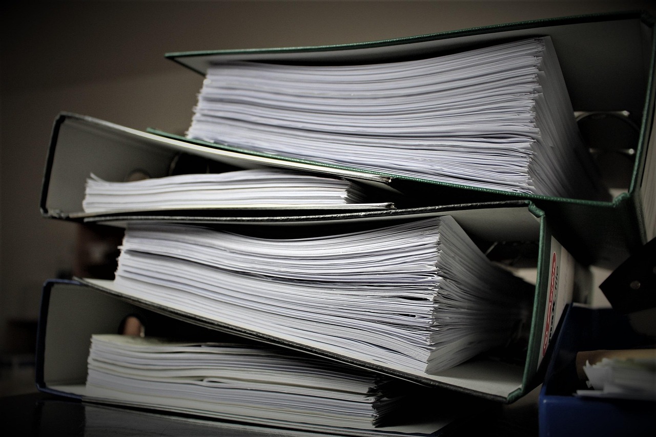 Editorial photo for Can I Sue an Employer, showing employment records and workplace documents.