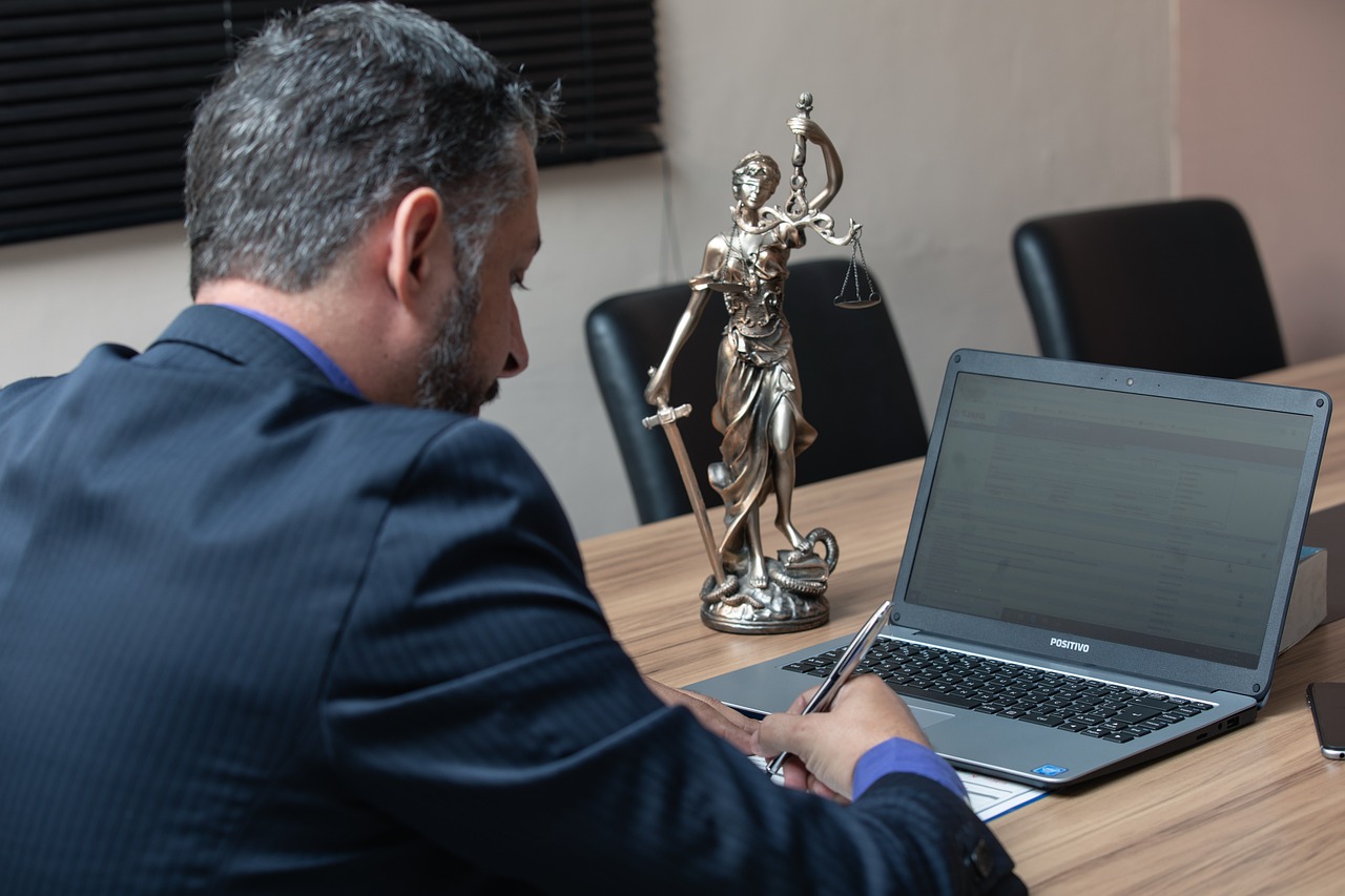 Editorial photo for Discrimination In Professional Golf Associations: Seeking Redress For Biased Tournament Selection And Treatment, showing legal research and consultation documents.