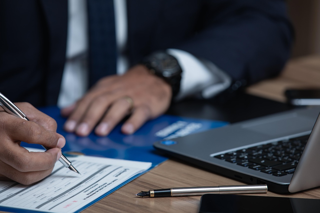Editorial photo for Breach Of Non-Compete Agreement: Protecting Business Interests, showing employment records and workplace documents.