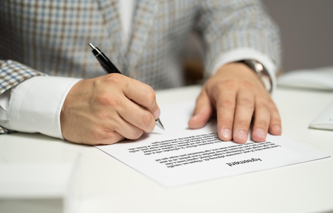 Editorial photo for Can I Sue My Employer for Disclosing Medical Information, showing employment records and workplace documents.