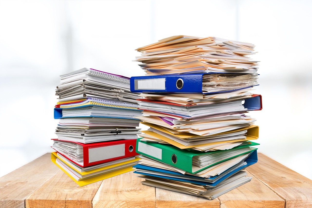 Editorial photo for Emotional Abuse In Online Communities: Legal Options For Cyberbullying And Harassment, showing employment records and workplace documents.