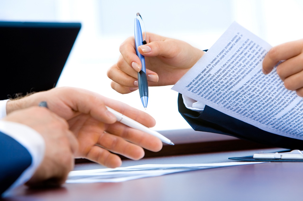 Editorial photo for Can I Sue My Employer for Mental Stress, showing employment records and workplace documents.