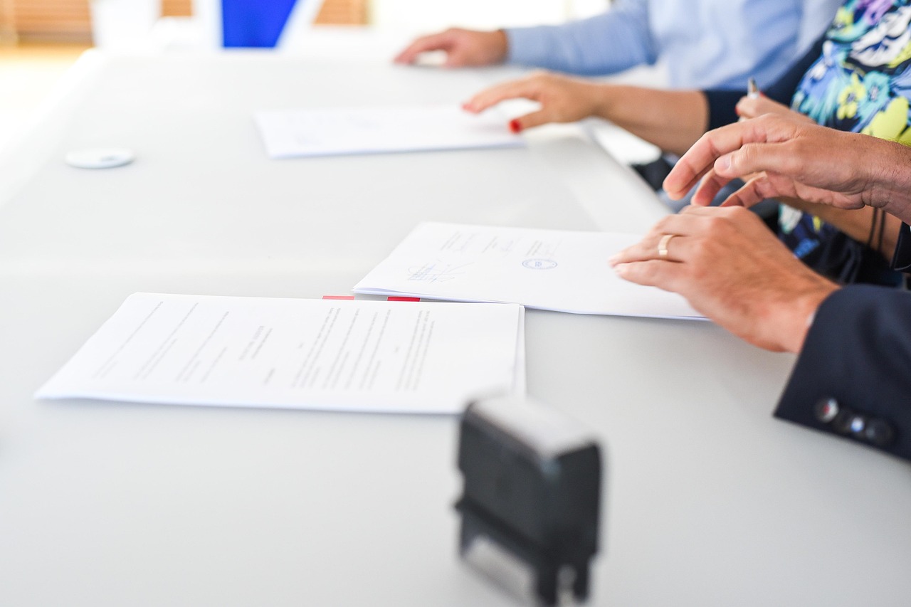 Editorial photo for Breach Of Non-Solicit Clause In Entertainment Contracts: Protecting Talent Relationships And Professional Engagements, showing business contracts, invoices, and settlement paperwork.
