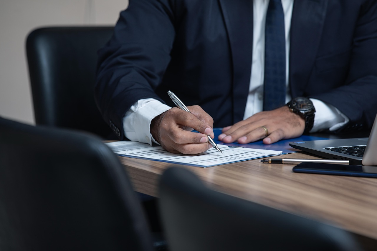 Editorial photo for Professional Negligence: Can You Sue For Inadequate Services?, showing business contracts, invoices, and settlement paperwork.